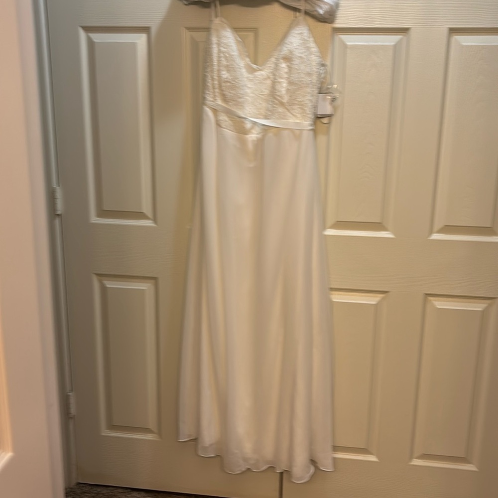 David’s Bridal wedding dress size 22. Never wore. Tags still on.